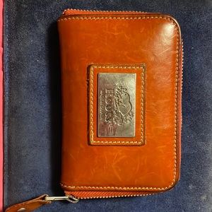 ROOTS Leather wallet. Credit card slots, inner zipper. Visible wear